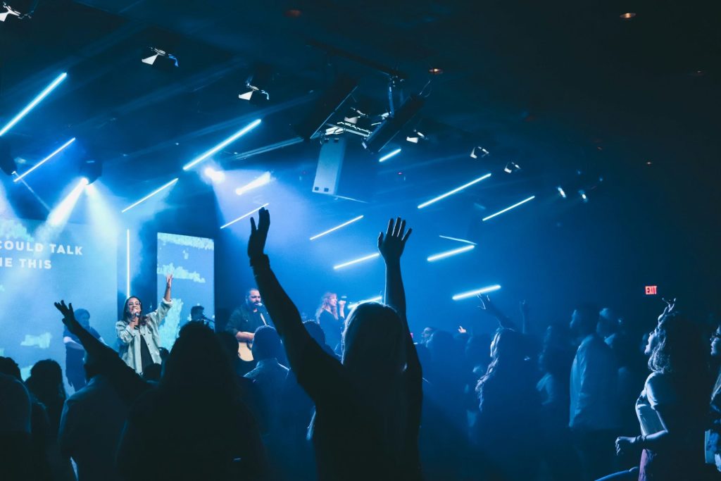 a group of people standing on top of a stage